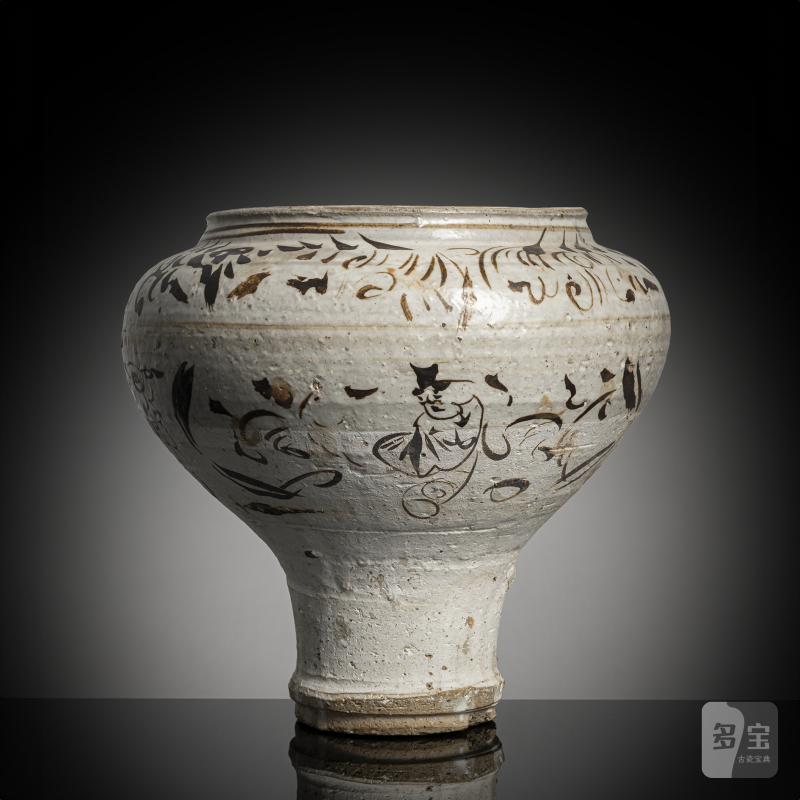A Cizhou jar with figure decoration and a stylised inscription in Cizhou ware